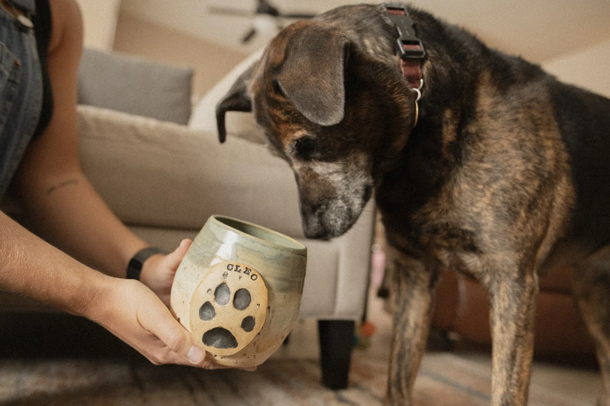 Artisan glazing a ceramic keepsake