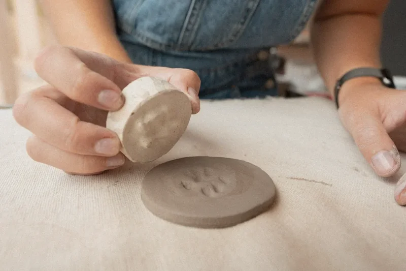 Image: artisan finishing a memorial piece