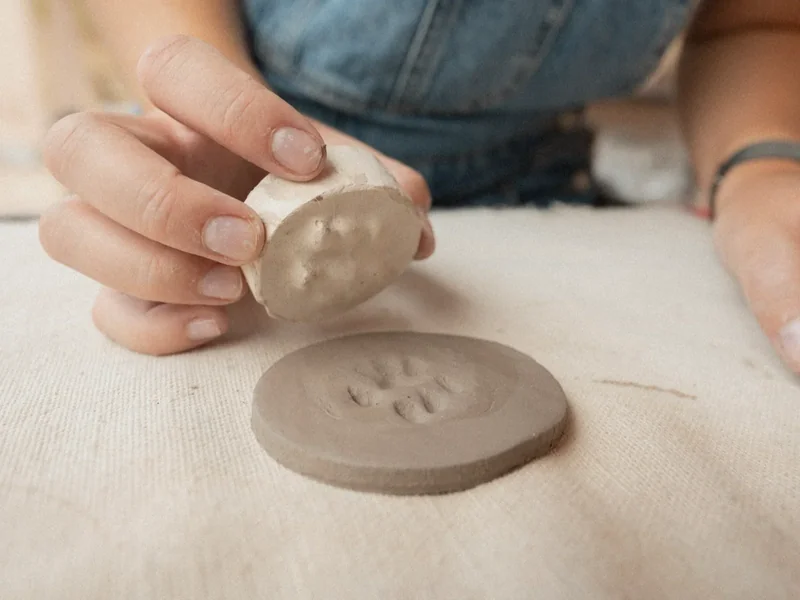 Image: transferring impression onto clay